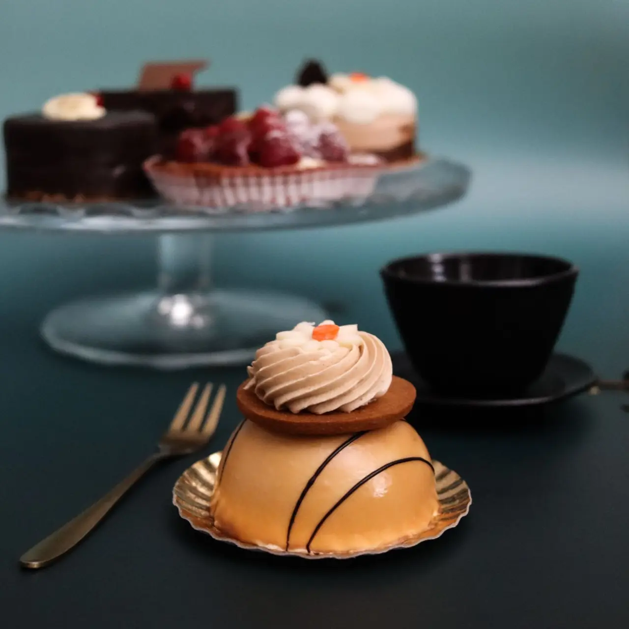 Plated gourmet French pastry selection with delicate sugar work